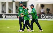 15 June 2025; Paul Stirling of Ireland, centre, with George Dockrell and Ross Adair after claiming the wicket of Evin Lewis of West Indies during match three of the T20 International Series between Ireland and the West Indies at Bready Cricket Club in Magheramason, Tyrone. Photo by Ramsey Cardy/Sportsfile
