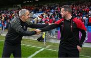 15 June 2025; Clare manager Peter Keane, left, shakes hands with Louth manager Ger Brennan after the GAA Football All-Ireland Senior Championship Round 3 match between Louth and Clare at Laois Hire O'Moore Park in Portlaoise, Laois. Photo by Shauna Clinton/Sportsfile