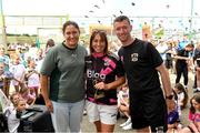 15 June 2025; Blathnaid Britt is presented with the senior player of the year trophy by Hannah Dingley, FAI Head of Women & Girls' Football and Waterford FC head coach Gary Hunt during the Honouring Every Woman event at Graun Park in Tramore, Waterford. Photo by Matt Browne/Sportsfile