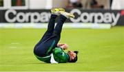 15 June 2025; Paul Stirling of Ireland claims the wicket of Evin Lewis of West Indies during match three of the T20 International Series between Ireland and the West Indies at Bready Cricket Club in Magheramason, Tyrone. Photo by Ramsey Cardy/Sportsfile