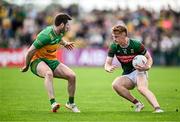 15 June 2025; Jack Carney of Mayo in action against Eoghan Bán Gallagher of Donegal during the GAA Football All-Ireland Senior Championship Round 3 match between Donegal and Mayo at King & Moffatt Dr Hyde Park in Roscommon. Photo by Seb Daly/Sportsfile
