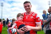 15 June 2025; Conall McKeever of Louth with his son Jessie, aged five months, after the GAA Football All-Ireland Senior Championship Round 3 match between Louth and Clare at Laois Hire O'Moore Park in Portlaoise, Laois. Photo by Shauna Clinton/Sportsfile