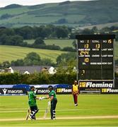15 June 2025; Ireland batters Paul Stirling, left, and Ross Adair during match three of the T20 International Series between Ireland and the West Indies at Bready Cricket Club in Magheramason, Tyrone. Photo by Ramsey Cardy/Sportsfile