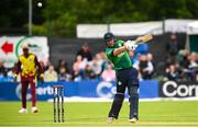 15 June 2025; Ross Adair of Ireland hits a four during match three of the T20 International Series between Ireland and the West Indies at Bready Cricket Club in Magheramason, Tyrone. Photo by Ramsey Cardy/Sportsfile