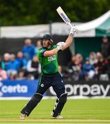 15 June 2025; Ross Adair of Ireland hits a four during match three of the T20 International Series between Ireland and the West Indies at Bready Cricket Club in Magheramason, Tyrone. Photo by Ramsey Cardy/Sportsfile