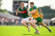 15 June 2025; Ciaran Moore of Donegal in action against David McBrien of Mayo during the GAA Football All-Ireland Senior Championship Round 3 match between Donegal and Mayo at King & Moffatt Dr Hyde Park in Roscommon. Photo by Seb Daly/Sportsfile