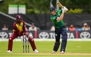 15 June 2025; Ireland batter Harry Tector and West Indies wicketkeeper Shai Hope during match three of the T20 International Series between Ireland and the West Indies at Bready Cricket Club in Magheramason, Tyrone. Photo by Ramsey Cardy/Sportsfile