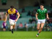 15 June 2025; Páiric Hughes of Wexford in action against Emmett Rigter of Limerick during the Tailteann Cup quarter-final match between Limerick and Wexford at TUS Gaelic Grounds in Limerick. Photo by Tom Beary/Sportsfile