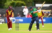 15 June 2025; Ireland batter Ross Adair and West Indies wicketkeeper Shai Hope during match three of the T20 International Series between Ireland and the West Indies at Bready Cricket Club in Magheramason, Tyrone. Photo by Ramsey Cardy/Sportsfile