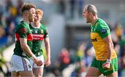 15 June 2025; Michael Murphy of Donegal celebrates in front of Mayo's Darren McHale after the GAA Football All-Ireland Senior Championship Round 3 match between Donegal and Mayo at King & Moffatt Dr Hyde Park in Roscommon. Photo by Seb Daly/Sportsfile