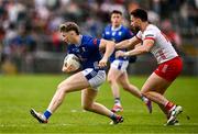 15 June 2025; Paddy Lynch of Cavan in action against Padraig Hampsey of Tyrone during the GAA Football All-Ireland Senior Championship Round 3 match between Tyrone and Cavan at Brewster Park in Enniskillen, Fermanagh. Photo by Ben McShane/Sportsfile