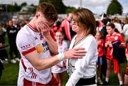 15 June 2025; An emotional Conor Meyler of Tyrone is consoled by his mother Paula following his return to action after a 23 month absence due to injury after the GAA Football All-Ireland Senior Championship Round 3 match between Tyrone and Cavan at Brewster Park in Enniskillen, Fermanagh. Photo by Ben McShane/Sportsfile