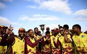15 June 2025; West Indies players with the trophy after match three of the T20 International Series between Ireland and the West Indies at Bready Cricket Club in Magheramason, Tyrone. Photo by Ramsey Cardy/Sportsfile