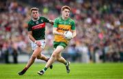 15 June 2025; Ciaran Moore of Donegal in action against Jordan Flynn of Mayo during the GAA Football All-Ireland Senior Championship Round 3 match between Donegal and Mayo at King & Moffatt Dr Hyde Park in Roscommon. Photo by Seb Daly/Sportsfile