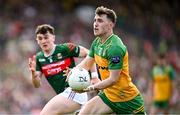 15 June 2025; Shane O'Donnell of Donegal in action against Seán Morahan of Mayo during the GAA Football All-Ireland Senior Championship Round 3 match between Donegal and Mayo at King & Moffatt Dr Hyde Park in Roscommon. Photo by Seb Daly/Sportsfile