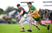 15 June 2025; Shane O'Donnell of Donegal in action against Seán Morahan of Mayo during the GAA Football All-Ireland Senior Championship Round 3 match between Donegal and Mayo at King & Moffatt Dr Hyde Park in Roscommon. Photo by Seb Daly/Sportsfile