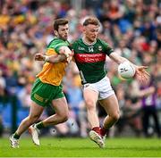 15 June 2025; Darren McHale of Mayo in action against Eoghan Bán Gallagher of Donegal during the GAA Football All-Ireland Senior Championship Round 3 match between Donegal and Mayo at King & Moffatt Dr Hyde Park in Roscommon. Photo by Seb Daly/Sportsfile