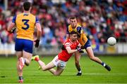 15 June 2025; Ciaran Downey of Louth is tackled by Emmet McMahon of Clare during the GAA Football All-Ireland Senior Championship Round 3 match between Louth and Clare at Laois Hire O'Moore Park in Portlaoise, Laois. Photo by Shauna Clinton/Sportsfile