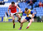 15 June 2025; Ronan Lanigan of Clare is tackled by Craig Lennon of Louth during the GAA Football All-Ireland Senior Championship Round 3 match between Louth and Clare at Laois Hire O'Moore Park in Portlaoise, Laois. Photo by Shauna Clinton/Sportsfile