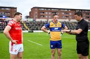 15 June 2025; Referee Barry Tiernan, right, with Clare captain Eoin Cleary, centre, and Louth captain Sam Mulroy during the GAA Football All-Ireland Senior Championship Round 3 match between Louth and Clare at Laois Hire O'Moore Park in Portlaoise, Laois. Photo by Shauna Clinton/Sportsfile