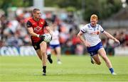 15 June 2025; Pat Havern of Down in action against Ryan O'Toole of Monaghan during the GAA Football All-Ireland Senior Championship Round 3 match between Monaghan and Down at BOX-IT Athletic Grounds in Armagh. Photo by Thomas Flinkow/Sportsfile