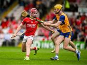 15 June 2025; Eoghan O'Shea of Cork in action against Dara Kennedy of Clare during the Electric Ireland GAA Hurling All-Ireland Minor Championship semi-final match between Cork and Clare at FBD Semple Stadium in Thurles, Tipperary. Photo by Brendan Moran/Sportsfile