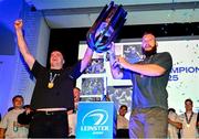 14 June 2025; Leinster players James Ryan, left, and RG Snyman show the URC trophy off to friends and family at a post match event in the RDS, Dublin, following the United Rugby Championship Grand Final match between Leinster and Vodacom Bulls. Photo by Brendan Moran/Sportsfile