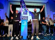 14 June 2025; Leinster players James Ryan, left, and RG Snyman show the URC trophy off to friends and family at a post match event in the RDS, Dublin, following the United Rugby Championship Grand Final match between Leinster and Vodacom Bulls. Photo by Brendan Moran/Sportsfile