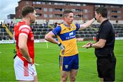 15 June 2025; Referee Barry Tiernan, right, with Clare captain Eoin Cleary, centre, and Louth captain Sam Mulroy during the GAA Football All-Ireland Senior Championship Round 3 match between Louth and Clare at Laois Hire O'Moore Park in Portlaoise, Laois. Photo by Shauna Clinton/Sportsfile