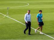 16 June 2025; St. Patrick's Athletic manager Stephen Kenny and player Simon Power walk the pitch before the SSE Airtricity Men's Premier Division match between St Patrick's Athletic and Shelbourne at Richmond Park in Dublin. Photo by Thomas Flinkow/Sportsfile