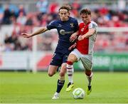 316 June 2025; Anto Breslin of St. Patrick's Athletic in action against Harry Wood of Shelbourne during the SSE Airtricity Men's Premier Division match between St Patrick's Athletic and Shelbourne at Richmond Park in Dublin. Photo by Thomas Flinkow/Sportsfile