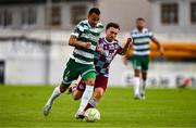 16 June 2025; Graham Burke of Shamrock Rovers in action against Darragh Markey of Drogheda United during the SSE Airtricity Men's Premier Division match between Drogheda United and Shamrock Rovers at Sullivan & Lambe Park in Drogheda, Louth. Photo by Ben McShane/Sportsfile