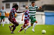 16 June 2025; Graham Burke of Shamrock Rovers in action against Thomas Oluwa of Drogheda United during the SSE Airtricity Men's Premier Division match between Drogheda United and Shamrock Rovers at Sullivan & Lambe Park in Drogheda, Louth. Photo by Ben McShane/Sportsfile