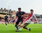 16 June 2025; Simon Power of St. Patrick's Athletic is tackled by Sam Bone of Shelbourne during the SSE Airtricity Men's Premier Division match between St Patrick's Athletic and Shelbourne at Richmond Park in Dublin. Photo by Thomas Flinkow/Sportsfile