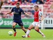16 June 2025; Sean Boyd of Shelbourne in action against Jamie Lennon of St. Patrick's Athletic during the SSE Airtricity Men's Premier Division match between St Patrick's Athletic and Shelbourne at Richmond Park in Dublin. Photo by Thomas Flinkow/Sportsfile