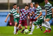 16 June 2025; Darragh Markey of Drogheda United is tackled by Dylan Watts, left, and Graham Burke of Shamrock Rovers during the SSE Airtricity Men's Premier Division match between Drogheda United and Shamrock Rovers at Sullivan & Lambe Park in Drogheda, Louth. Photo by Ben McShane/Sportsfile