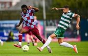 16 June 2025; Thomas Oluwa of Drogheda United is tackled by Lee Grace of Shamrock Rovers during the SSE Airtricity Men's Premier Division match between Drogheda United and Shamrock Rovers at Sullivan & Lambe Park in Drogheda, Louth. Photo by Ben McShane/Sportsfile