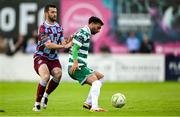 16 June 2025; Danny Mandroiu of Shamrock Rovers in action against Ryan Brennan of Drogheda United during the SSE Airtricity Men's Premier Division match between Drogheda United and Shamrock Rovers at Sullivan & Lambe Park in Drogheda, Louth. Photo by Shauna Clinton/Sportsfile