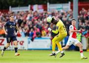 16 June 2025; St. Patrick's Athletic goalkeeper Joseph Anang heads the ball clear during the SSE Airtricity Men's Premier Division match between St Patrick's Athletic and Shelbourne at Richmond Park in Dublin. Photo by Thomas Flinkow/Sportsfile