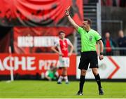 16 June 2025; Referee Paul Norton shows a yellow card to Shelbourne manager Damien Duff, not pictured, during the SSE Airtricity Men's Premier Division match between St Patrick's Athletic and Shelbourne at Richmond Park in Dublin. Photo by Thomas Flinkow/Sportsfile