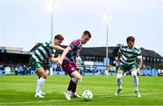 16 June 2025; Warren Davis of Drogheda United in action against Daniel Cleary, left, and Danny Grant of Shamrock Rovers during the SSE Airtricity Men's Premier Division match between Drogheda United and Shamrock Rovers at Sullivan & Lambe Park in Drogheda, Louth. Photo by Ben McShane/Sportsfile