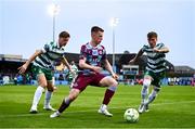 16 June 2025; Warren Davis of Drogheda United in action against Daniel Cleary, left, and Danny Grant of Shamrock Rovers during the SSE Airtricity Men's Premier Division match between Drogheda United and Shamrock Rovers at Sullivan & Lambe Park in Drogheda, Louth. Photo by Ben McShane/Sportsfile