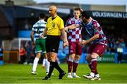 16 June 2025; Ryan Brennan of Drogheda United, right, remonstrates toward referee Neil Doyle during the SSE Airtricity Men's Premier Division match between Drogheda United and Shamrock Rovers at Sullivan & Lambe Park in Drogheda, Louth. Photo by Ben McShane/Sportsfile