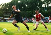 16 June 2025; Evan Caffrey of Shelbourne in action against Jay McClelland of St. Patrick's Athletic during the SSE Airtricity Men's Premier Division match between St Patrick's Athletic and Shelbourne at Richmond Park in Dublin. Photo by Thomas Flinkow/Sportsfile