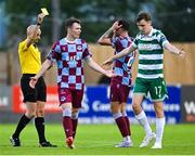16 June 2025; Referee Neil Doyle shows Luke Heeney of Drogheda United a yellow card during the SSE Airtricity Men's Premier Division match between Drogheda United and Shamrock Rovers at Sullivan & Lambe Park in Drogheda, Louth. Photo by Shauna Clinton/Sportsfile