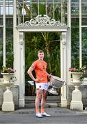 17 June 2025; Armagh footballer Oisín O'Neill poses for a portrait with the Sam Maguire Cup at the national launch of the GAA Football All-Ireland Senior Championship Series at the National Botanic Gardens in Dublin. Photo by Sam Barnes/Sportsfile