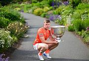 17 June 2025; Armagh footballer Oisín O'Neill poses for a portrait with the Sam Maguire Cup at the national launch of the GAA Football All-Ireland Senior Championship Series at the National Botanic Gardens in Dublin. Photo by Sam Barnes/Sportsfile