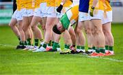 14 June 2025; Cathal Flynn of Offaly ties his laces before the Tailteann Cup quarter-final match between Kildare and Offaly at Cedral St Conleth's Park in Newbridge, Kildare. Photo by Piaras Ó Mídheach/Sportsfile