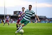 16 June 2025; Aaron Greene of Shamrock Rovers in action against Andrew Quinn of Drogheda United during the SSE Airtricity Men's Premier Division match between Drogheda United and Shamrock Rovers at Sullivan & Lambe Park in Drogheda, Louth. Photo by Shauna Clinton/Sportsfile