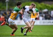 14 June 2025; Brian Byrne of Kildare in action against Cillian Bourke of Offaly during the Tailteann Cup quarter-final match between Kildare and Offaly at Cedral St Conleth's Park in Newbridge, Kildare. Photo by Piaras Ó Mídheach/Sportsfile
